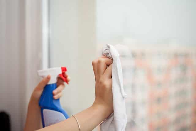 A woman using a cleaning product